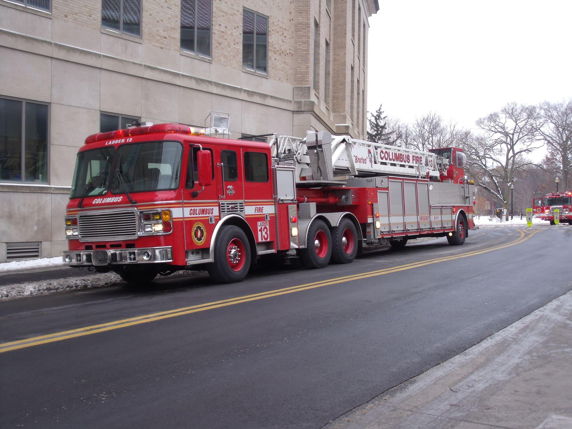 red ladder truck on a city street