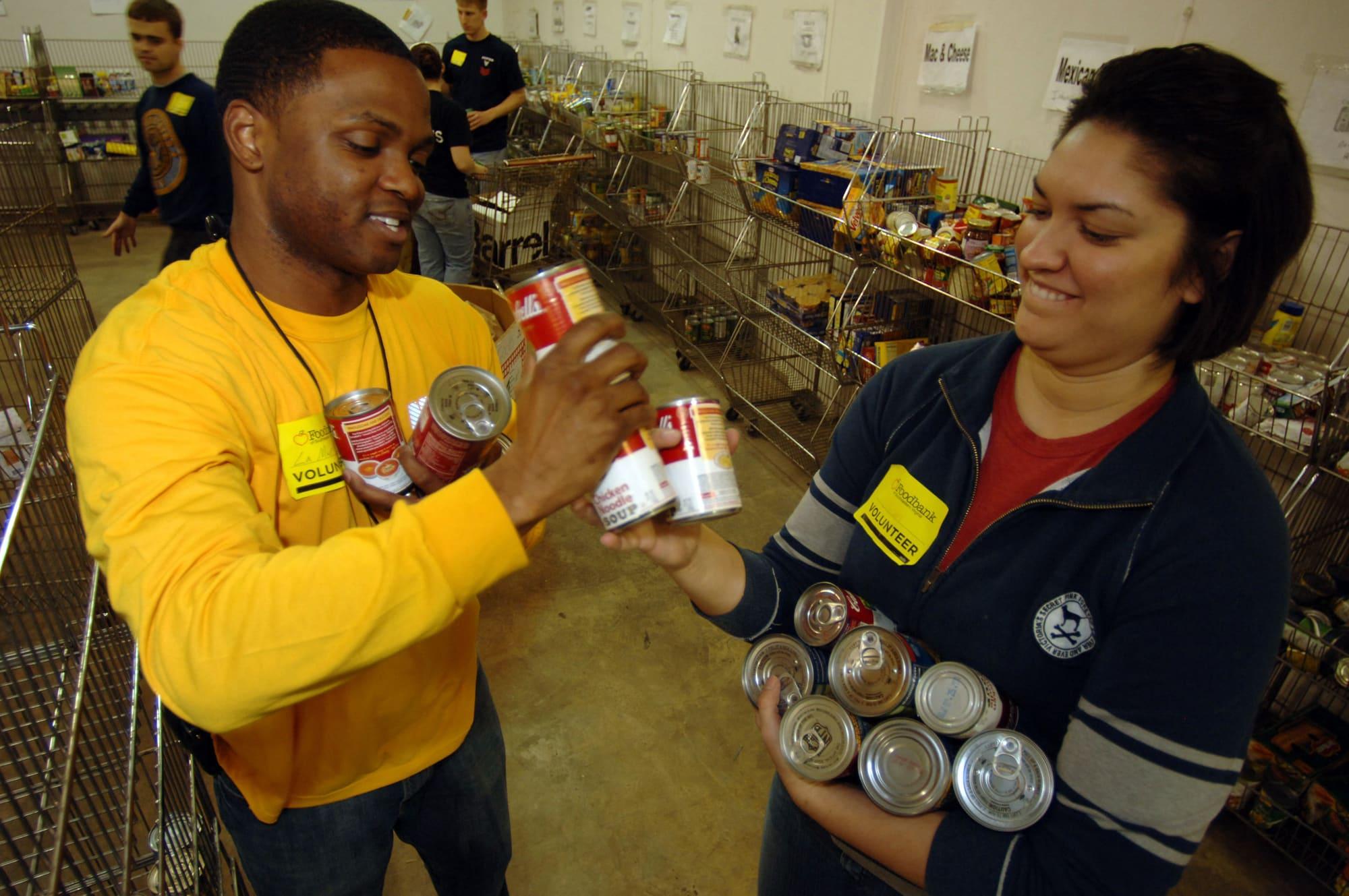 volunteers sorting donations at a food drive
