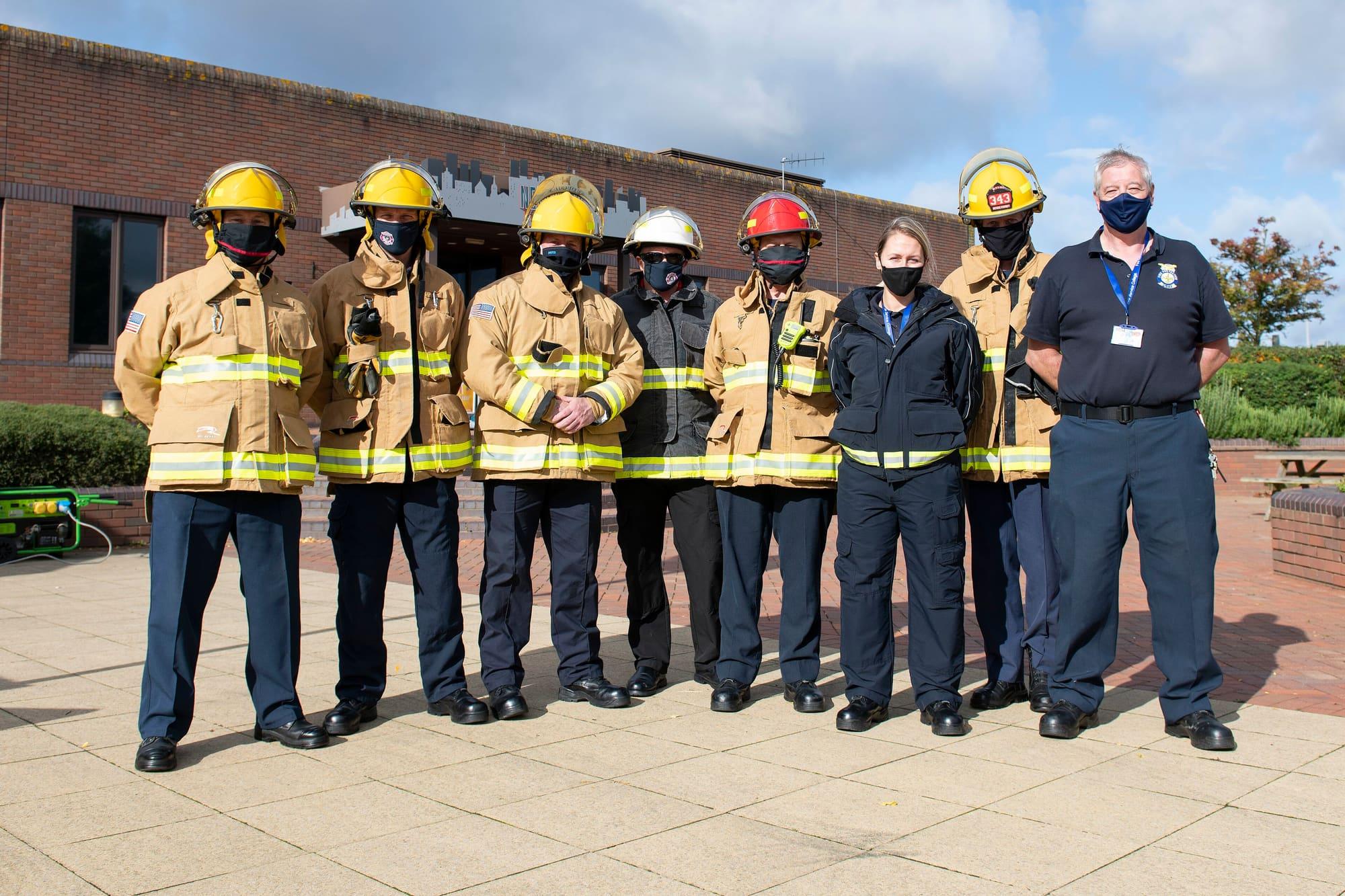 firefighters lined up in turnout gear